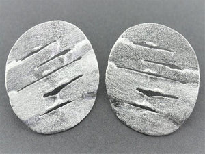 large distressed disc stud - Makers & Providers