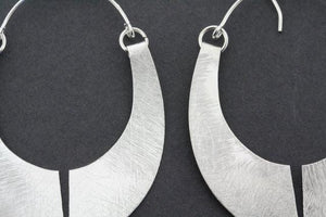 floating shield earring - Makers & Providers